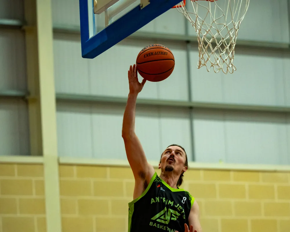 Antrim Jets basketball player finishes at the basket