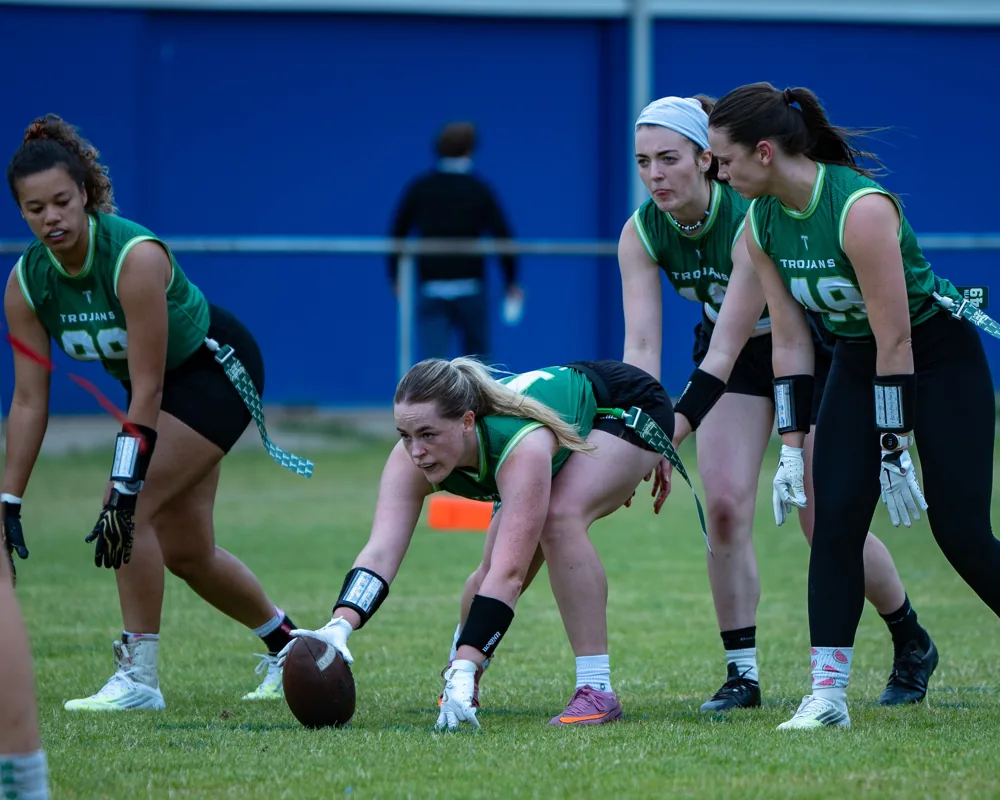 Belfast Trojans players line up behind the ball before the snap.