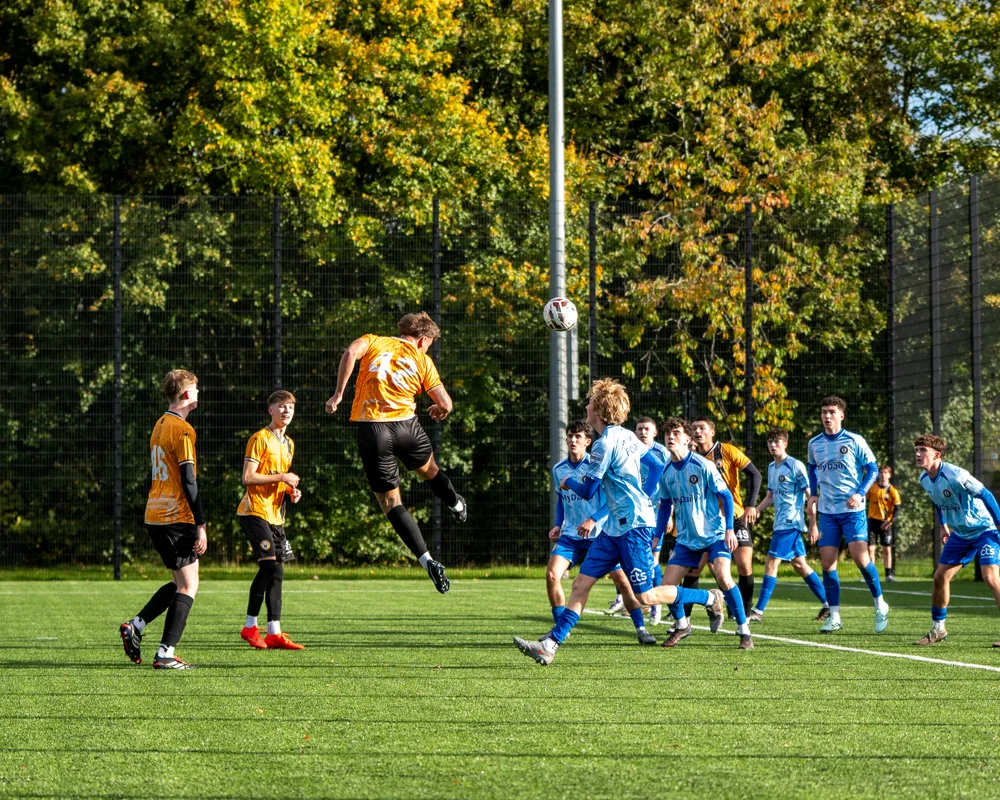Players watch play near the penalty area. H&W Welders Reserves v Warrenpoint Reserves.