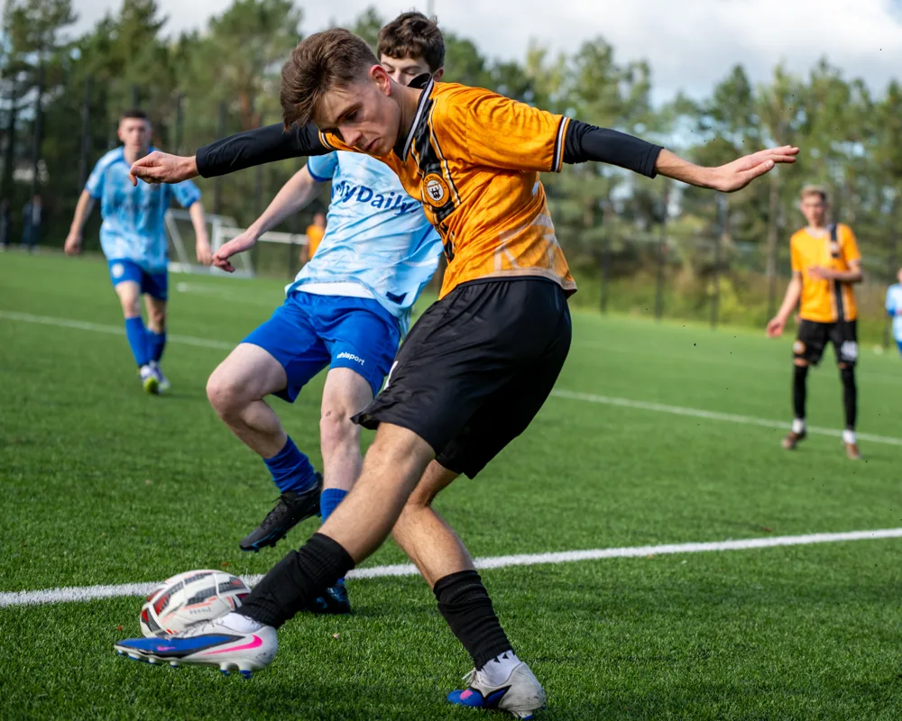 Opponents challenge for the ball. H&W Welders Reserves v Warrenpoint Reserves.