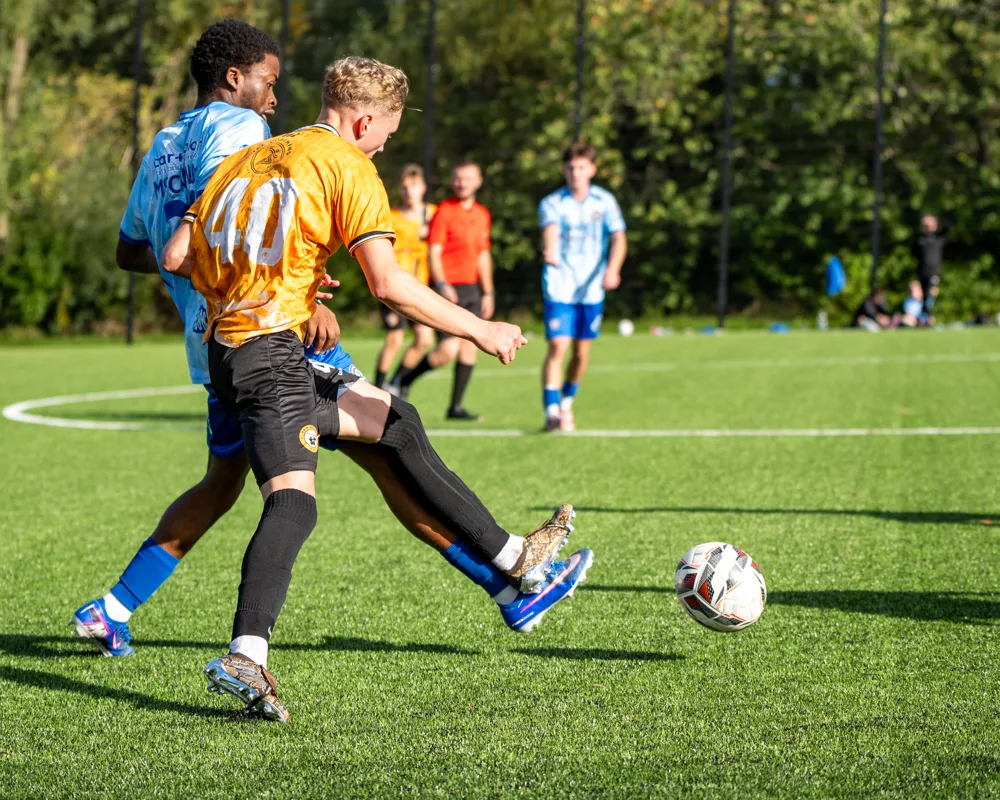Players compete for possession. H&W Welders Reserves v Warrenpoint Reserves.