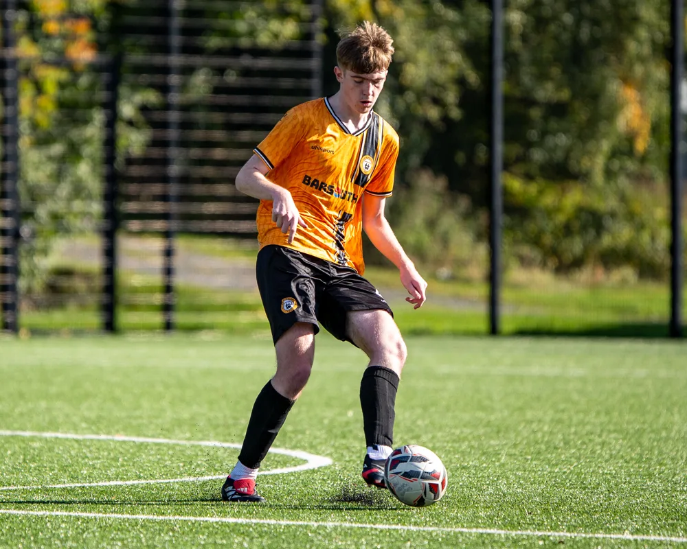 Player controls the ball. H&W Welders Reserves v Warrenpoint Reserves.