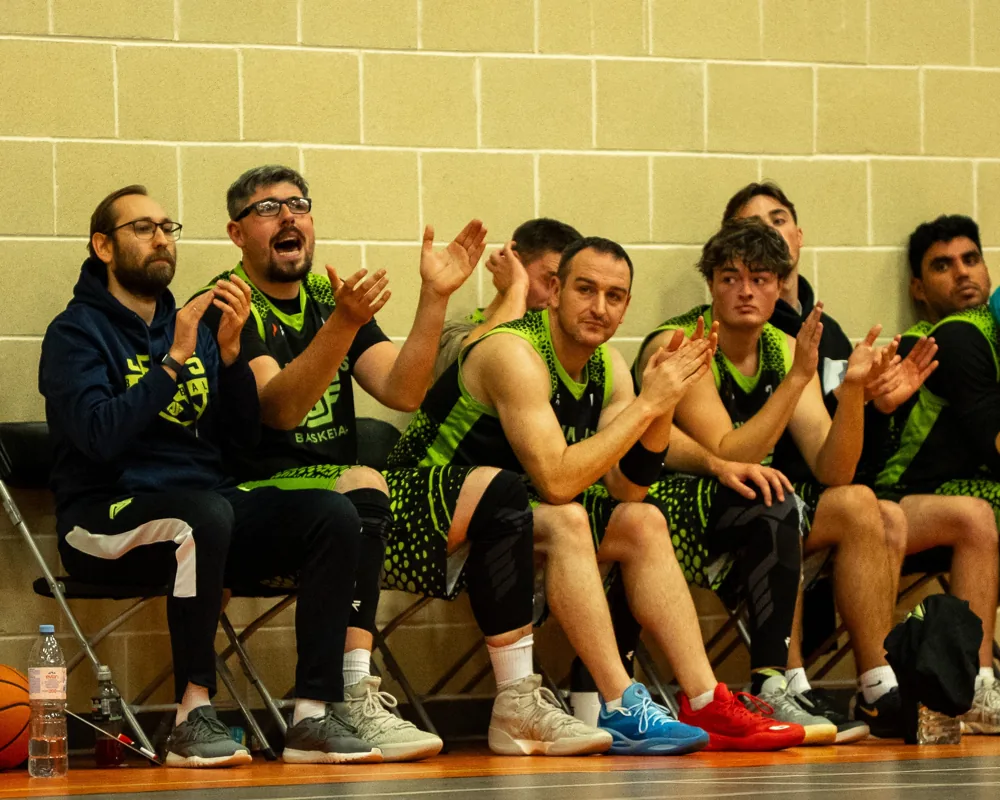 Antrim Jets substitutes clap and shout from the bench.