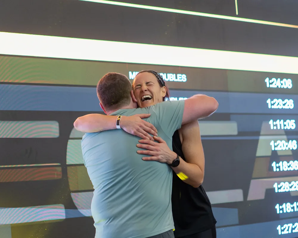 Competitors embrace. Mecca Sim 5.