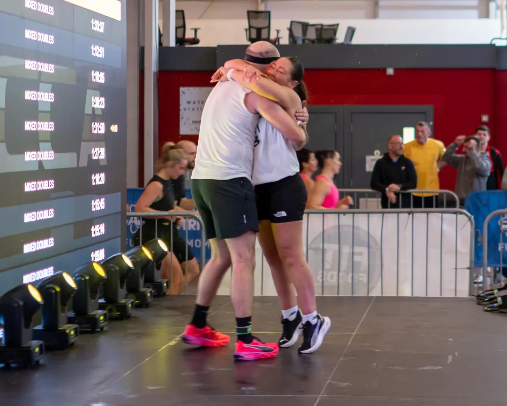Competitors embrace. Mecca Sim 5.