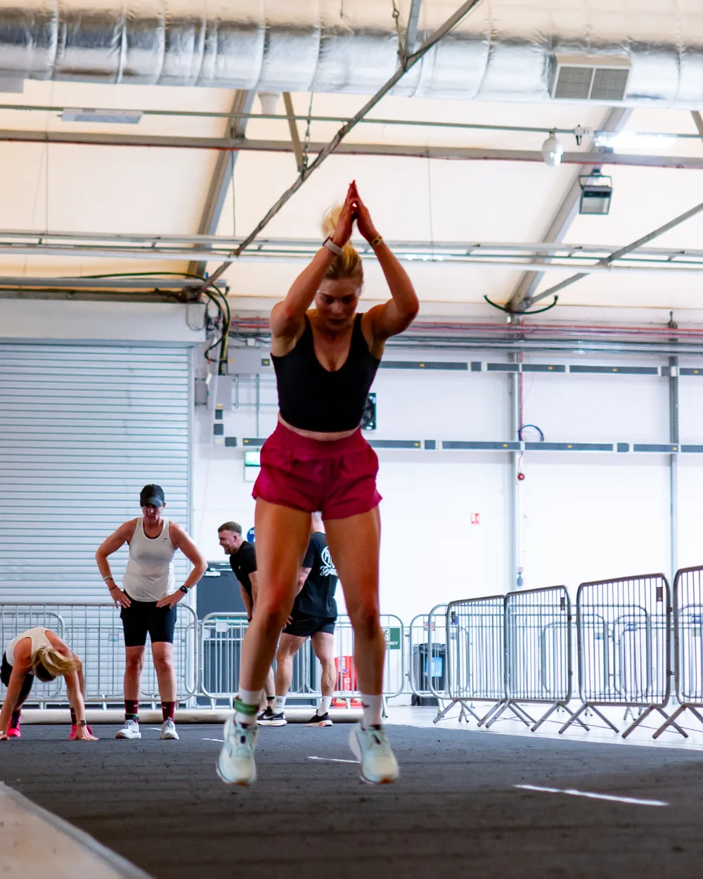 Athlete raises a ball overhead. Mecca Sim 5.