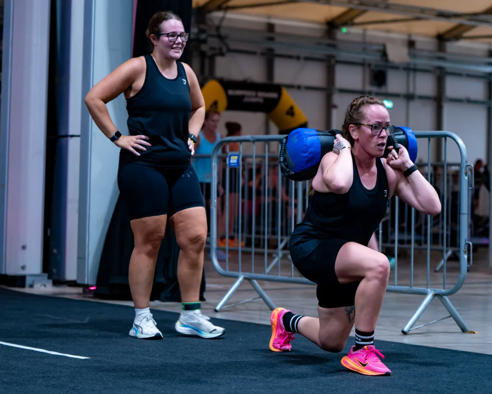 Athlete performs a weighted lunge. Mecca Sim 5.