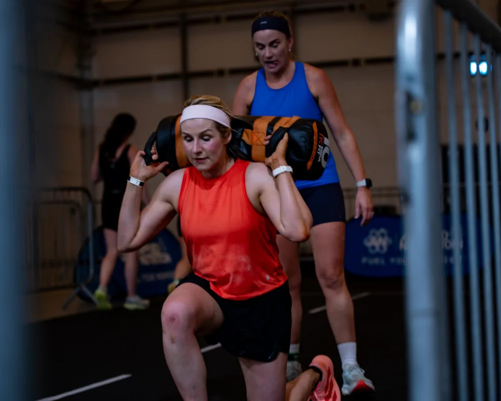 Athlete performs a weighted lunge. Mecca Sim 5.