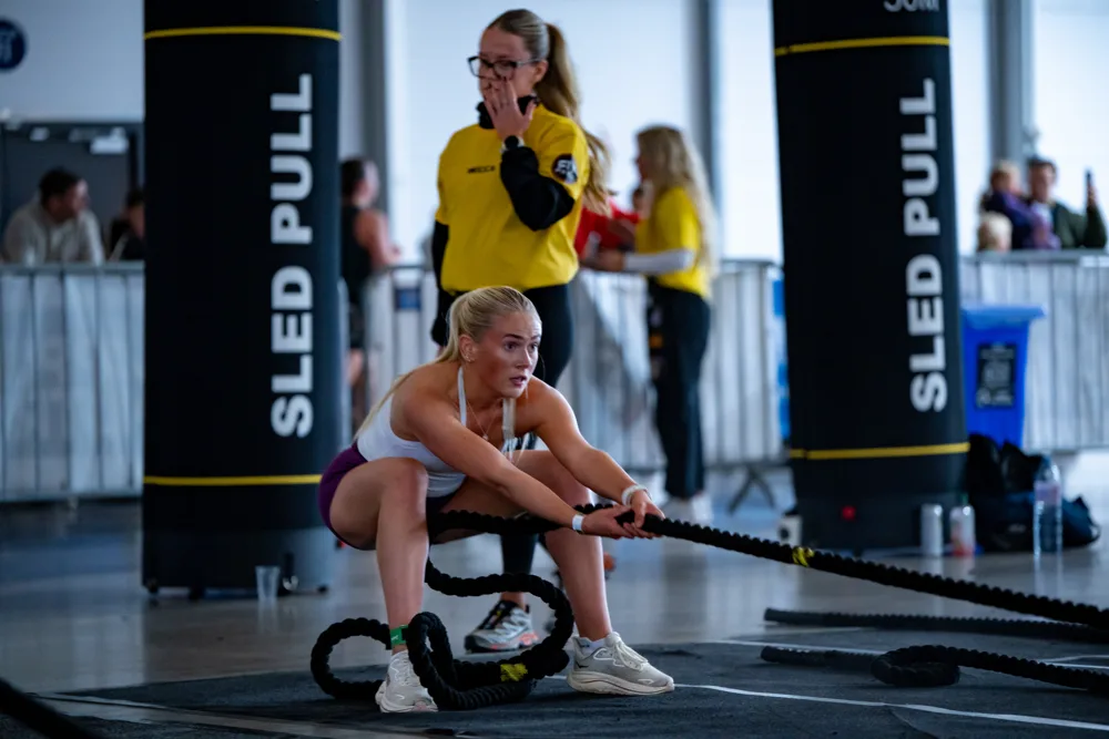 Athlete pulls a sled rope. Mecca Sim 5.