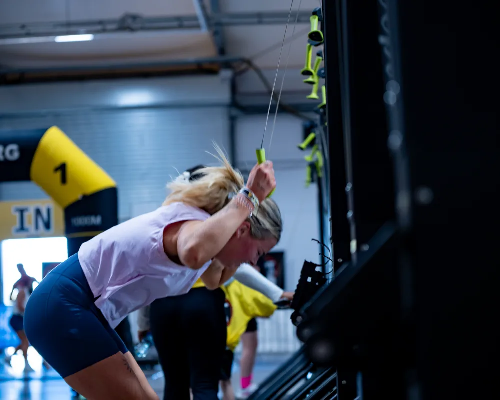 Athlete bends forward during an exercise. Mecca Sim 5.