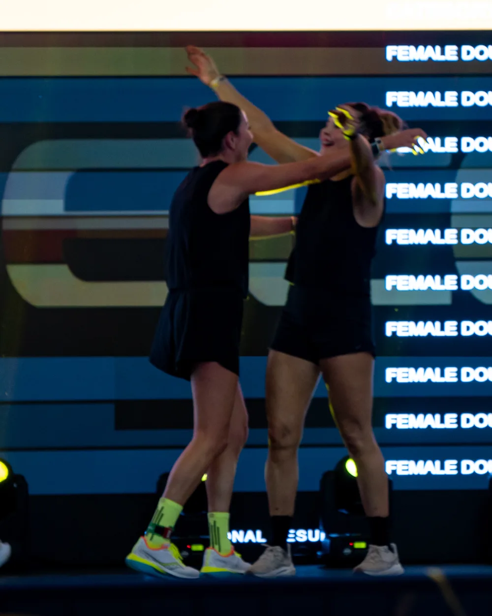 Competitors embrace. Mecca Sim 5.