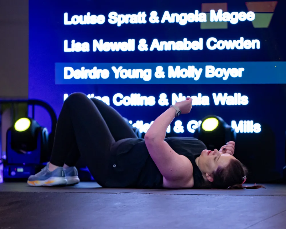 Competitor rests on the floor. Mecca Sim 5.
