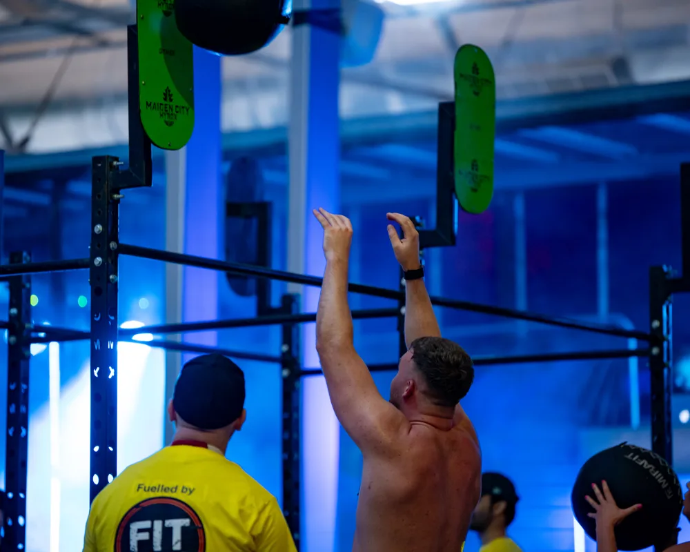 Athlete raises a ball overhead. Mecca Sim 5.