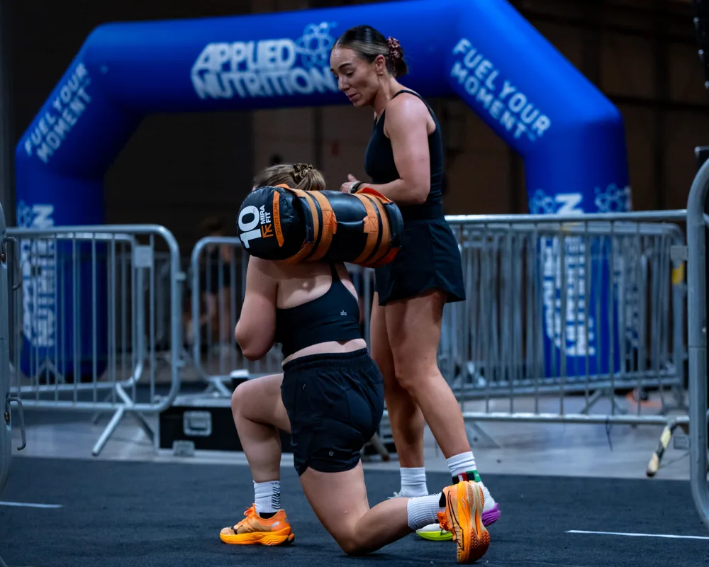 Athlete carries weights. Mecca Sim 5.