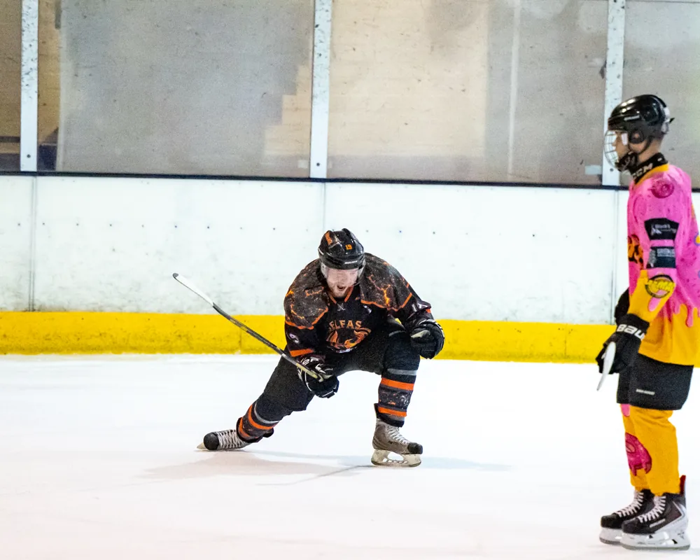 Phoenix player follows through on a low shot
