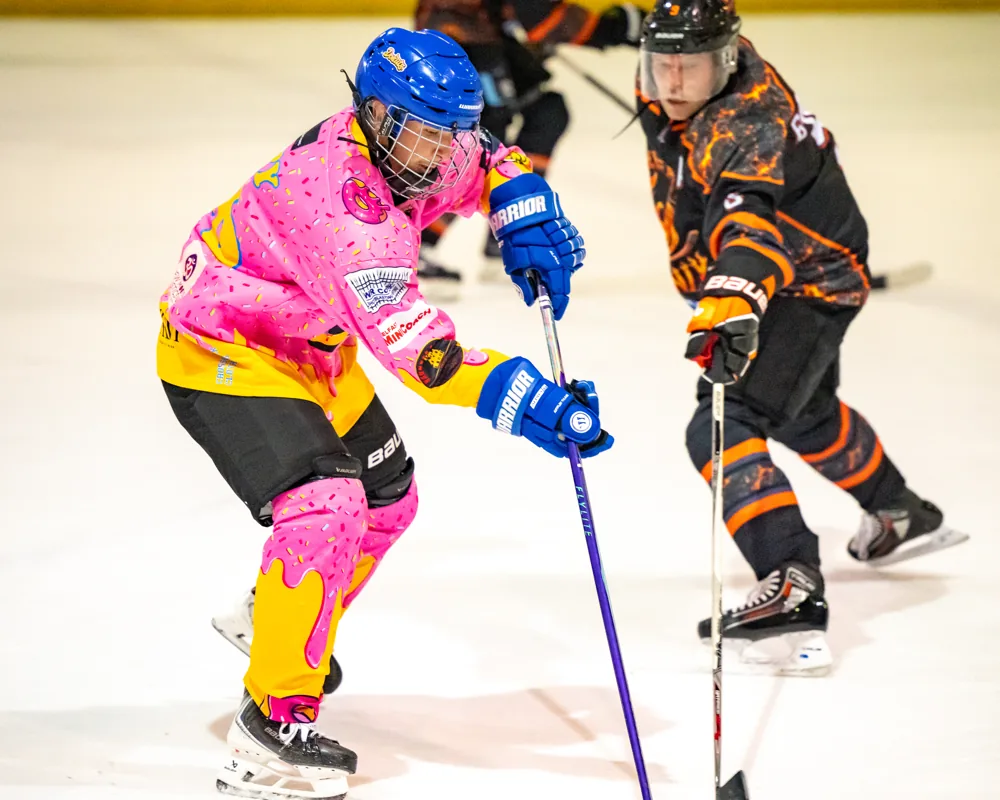 Donuts and Phoenix players contest possession