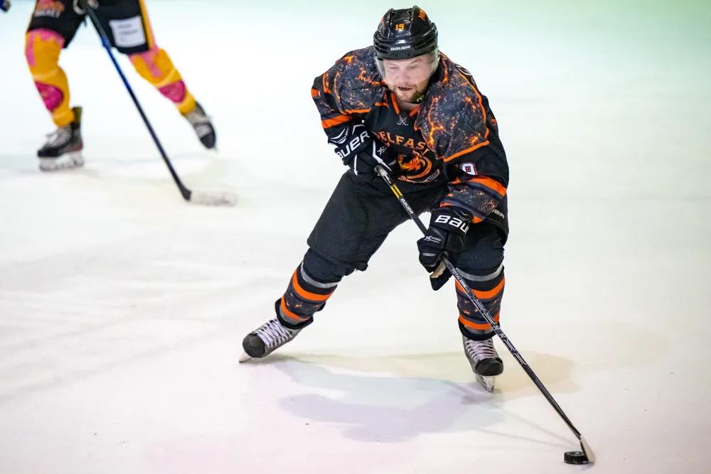 Phoenix player skates towards the camera with the puck