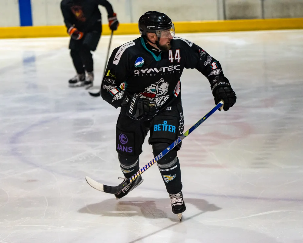 Player skates across the ice. Belfast Phoenix v Wild Hawks.